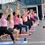 Pink Rooftop Poolside Yoga Class